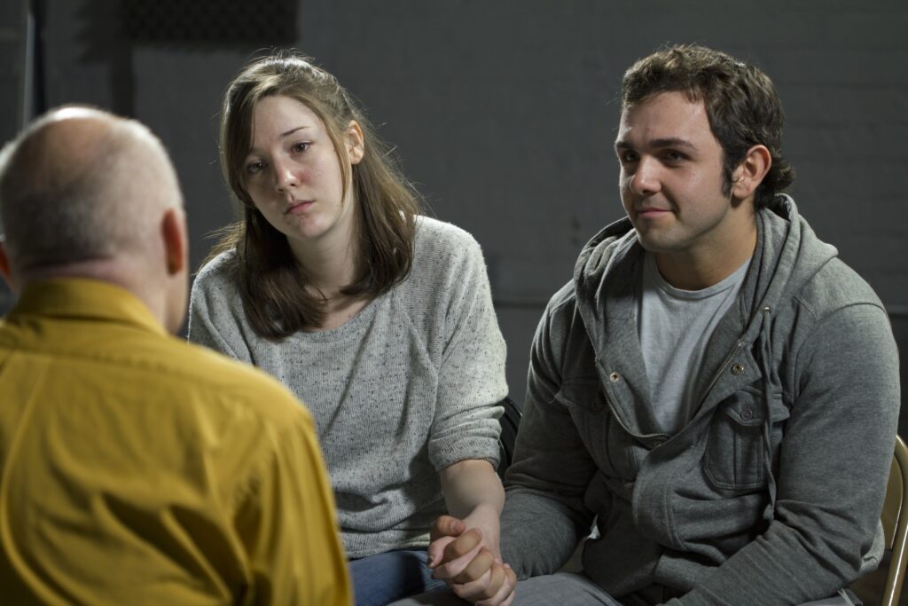 Young couple at couples therapy scaled