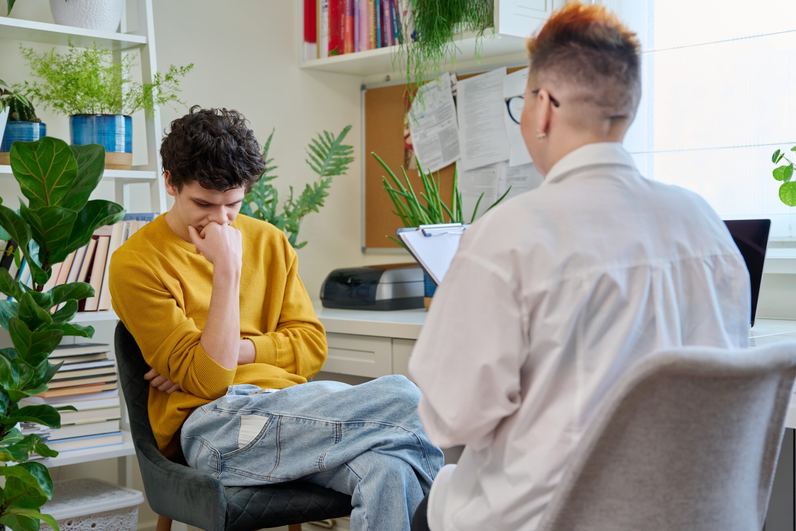 Young adult talking with a counselor about mental health and addiction