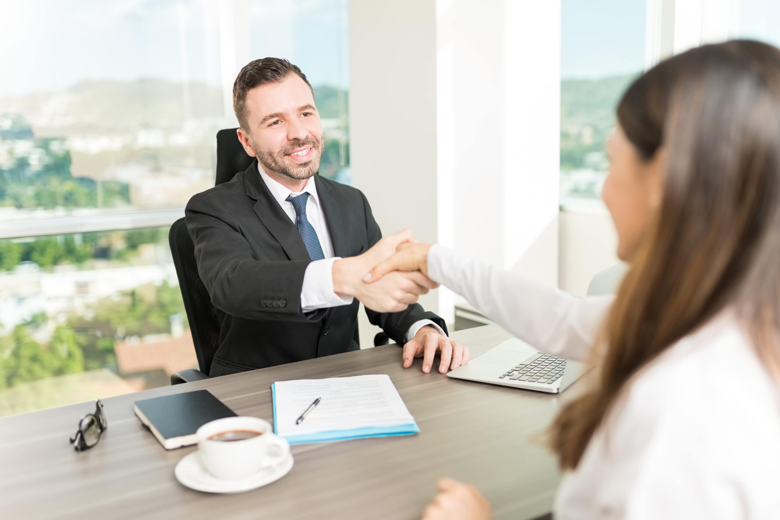 Professional person in recovery successfully explaining employment gap during a job interview