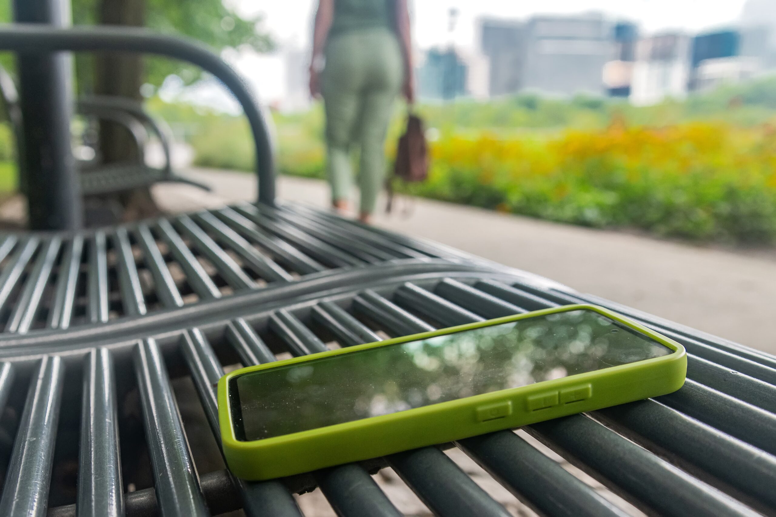 Someone journaling or walking outside with the phone left behind Person journaling outdoors while taking a break from technology during recovery