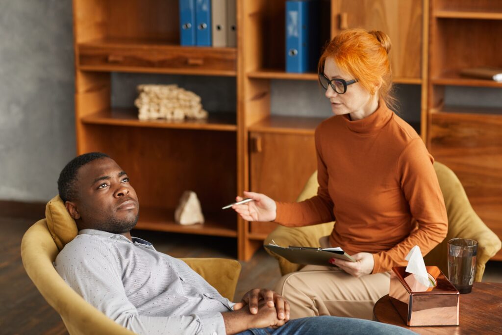 Discussing questions to ask before choosing a detox center with a professional at Inspire Recovery Center